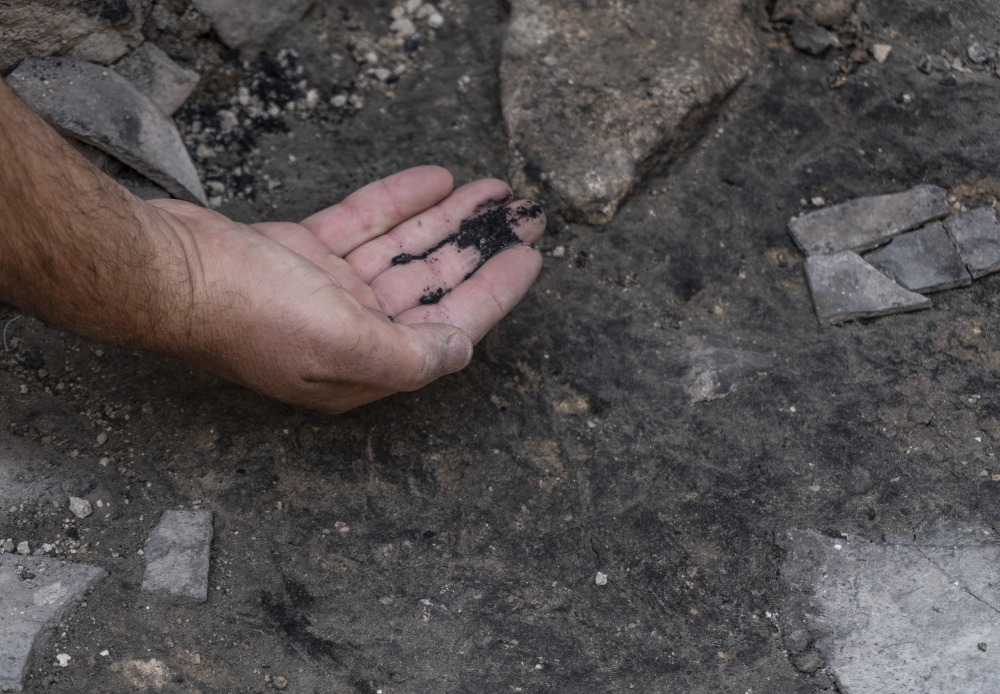 Ashes from The destruction at the site. Photographer Shai Halevi Israel Antiquities Authority