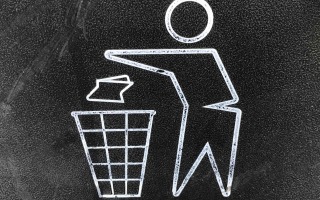 Close up of a recycle garbage bin logo. by gary chan, unsplash